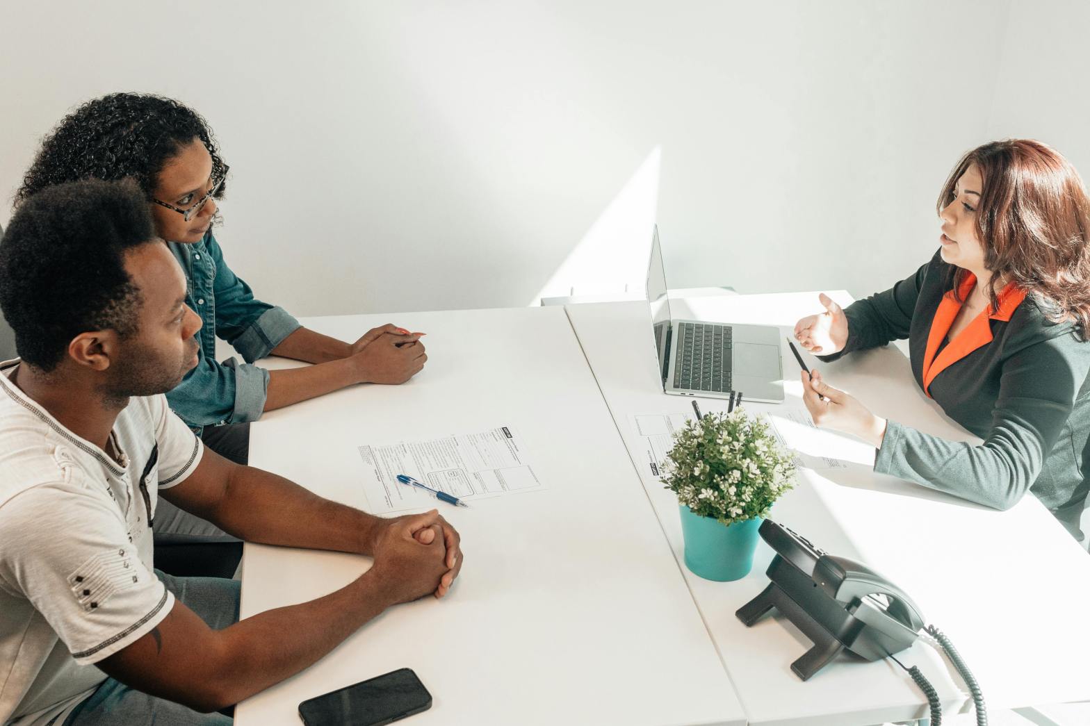 Couple meets with financial advisor in office