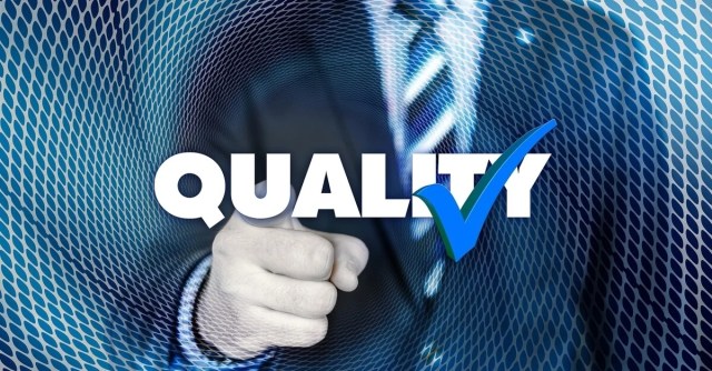 A man in a suit points with the word quality and a checkmark superimposed on the photo A man in a suit points with the word quality and a checkmark superimposed on the photo