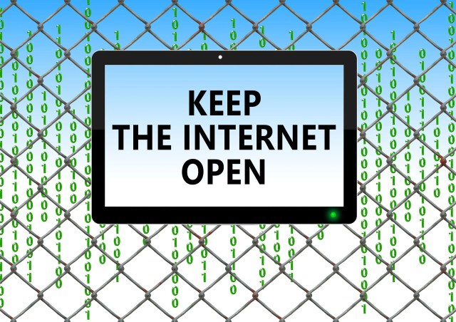 Tablet in front of fence with words that read, keep the Internet open for a blog post about how the end of net neutrality will affect content writers Tablet in front of fence with words that read, keep the Internet open for a blog post about how the end of net neutrality will affect content writers