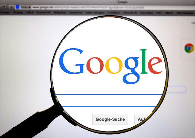 Image of Google's search page with a magnifying glass over the search box Image of Google's search page with a magnifying glass over the search box