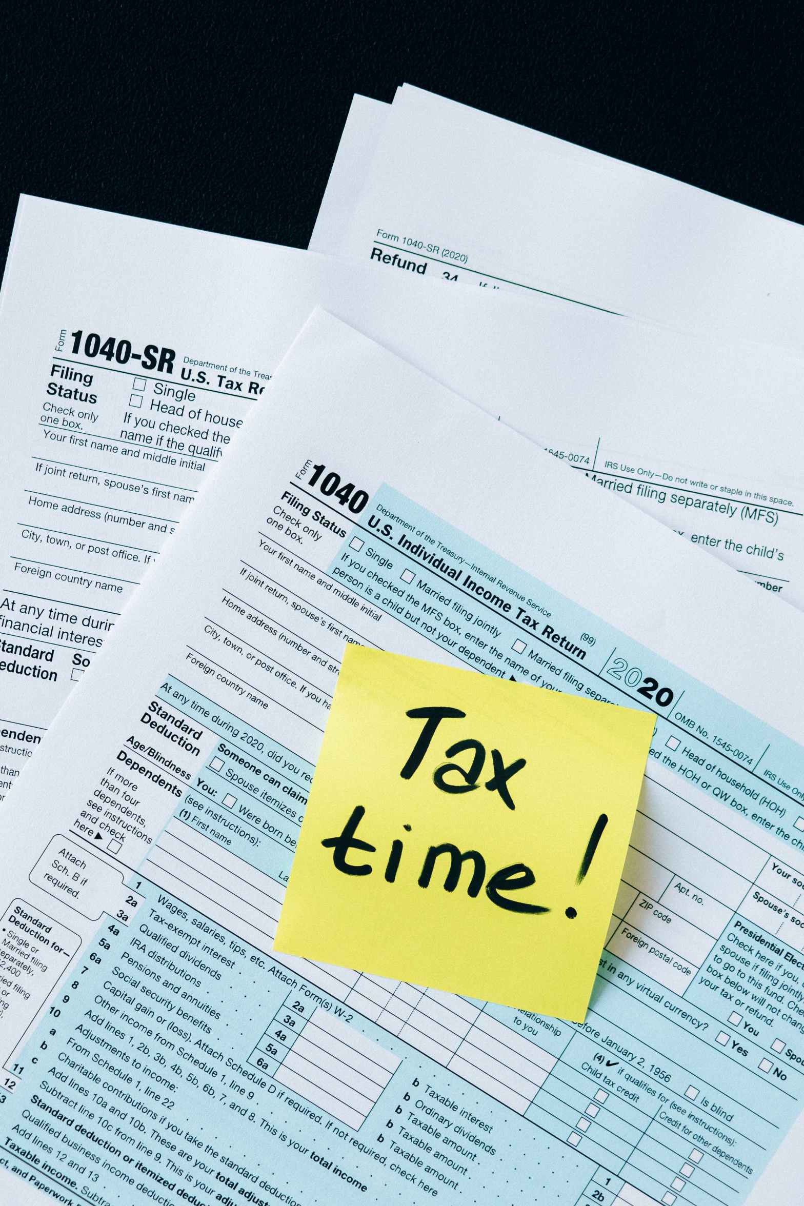 Tax documents with note reminding that it's time for taxes