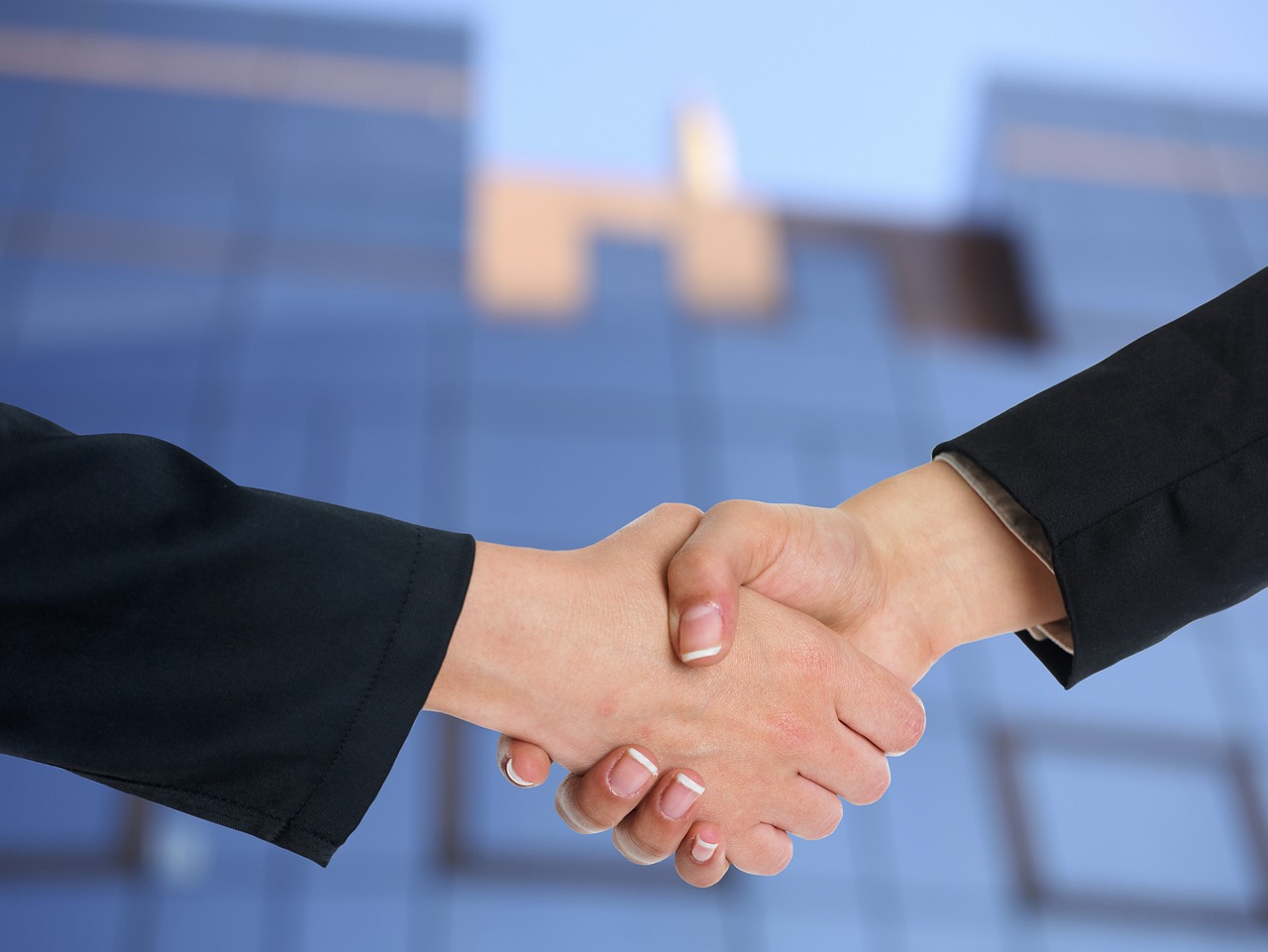Content marketing partners shaking hands agreeing upon work to be done