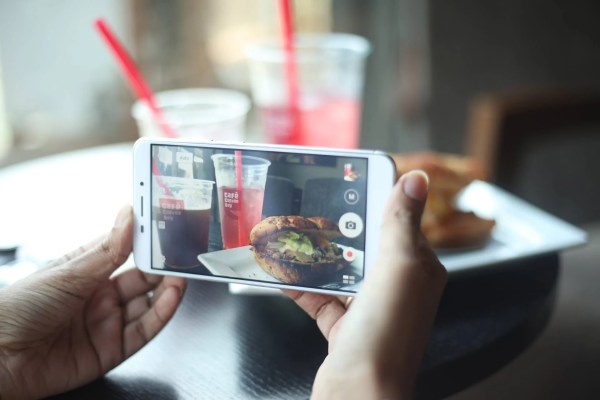 A foodie taking a picture of her meal